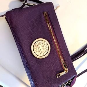 Clutch purse with over shoulder strap.